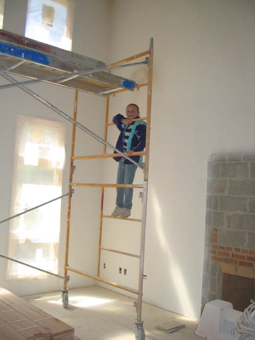 2004_05_15 081 Allison Testing the Paint Scafolding in the Living Room