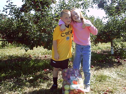 Allison and Corte in the orchard