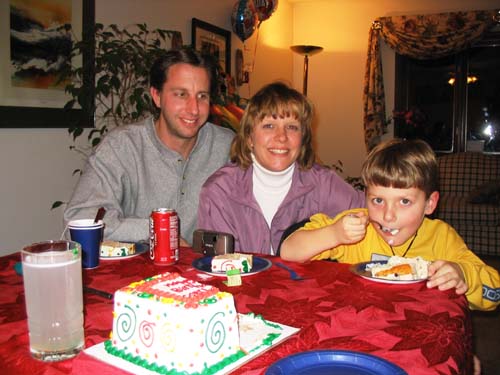 2004_02_13 023 Uncle David, Book, and Mason Pigging Out
